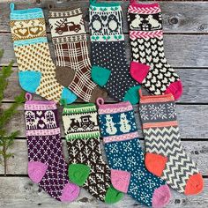 several pairs of colorful socks sitting on top of a wooden table