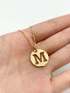 Gold Letter M Pendant made of Gold Vermeil: 18k Gold over Solid 925 Sterling Silver ☞ made to last.Matching Ring & Earrings ☞ please ask meDetails:• Letter M Pendant in Gold Vermeil• Dimensions: Pendant Height 20mm, Width 15mm• Free Complimentary Chain• 18k Gold VermeilSKU PE010490210 Tarnish Resistant Sterling Silver Jewelry For Mom, Hallmarked Gold Plated Initial Pendant Jewelry, Gold Plated Hallmarked Initial Pendant Jewelry, Gold Initials Jewelry As A Gift For Mom, 14k Gold Round Jewelry Gift For Mom, Yellow Gold Initials Jewelry For Mom, Hallmarked Rose Gold Initial Pendant Jewelry, Rose Gold Hallmarked Initial Pendant Jewelry, Hallmarked Rose Gold Jewelry With Initial Pendant