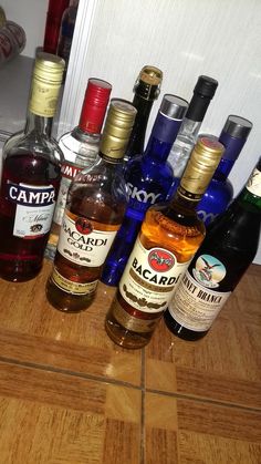 several different types of alcohol sitting on a counter