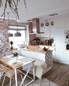 the kitchen is clean and ready to be used as a dining room or breakfast nook