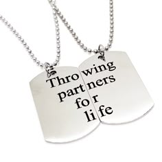 two dog tags with words on them that say,'thro wing partners for life '