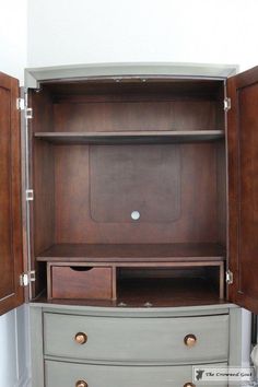 an armoire with two drawers and a tv in it's cabinet door open