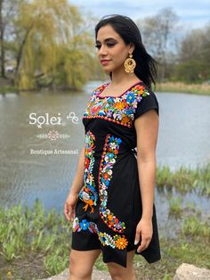 This Beautiful Mexican Colorful Floral Dress is the perfect dress for a fun night out or a special event. It is full of colorful embroidered flowers and has some crocheted details. This dress has ties on the back in order to adjust the fit. Please note: The accesories shown with this dress may purchased as well and Can be found in this link https://www.etsy.com/es/listing/637147293/filigrana-redonda-filigrana-clasica?ref=shop_home_active_1&pro=1&frs=1 Fitted Multicolor Floral Applique Dress, Fitted Multicolor Dress With Floral Applique, Fitted Multicolor Folk Dress, Multicolor Cotton Dress With Embroidered Neckline, Fitted Folk Style Multicolor Dress, Multicolor Floral Print Embroidered Dress For Festival, Spring Multicolor Embroidered Dress For Festival, Fitted Multicolor Embroidered Bohemian Dress, Multicolor Fitted Bohemian Embroidered Dress