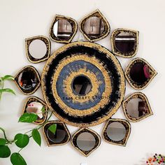 a decorative wall hanging with mirrors on it