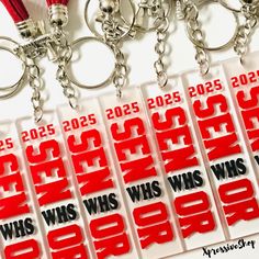 red and white keychains with the words whs, whs, whs and whs written on them