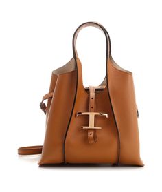 Tod's Timeless Logo Plaque Tote Bag | italist Elegant Tan Bucket Bag With Leather Handles, Cognac Calf Leather Tote Bag, Modern Tan Leather Shoulder Bag, Tan Tote Shoulder Bag With Gold-tone Hardware, Timeless Calf Leather Shopping Bag, Tan Leather-lined Shoulder Bag, Tan Shoulder Bag With Gold-tone Hardware, Luxury Tan Bag With Leather Lining, Tan Leather Lined Shoulder Bag