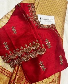 red and gold saree with golden border