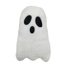 a white stuffed ghost with black eyes