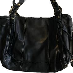 Soft Durable Black Leather Bag With Heavy Duty Brass Hardware. Leather And Suede Exterior Ties For The Boho Look Known To Lucky Brand. Embossed Leather Handles One Interior Zippered Compartment And Two Snap Closure Interior Pockets. Snap Top Closure This Is For Those Who Like A Large Bag That Will Hold Up Over Time. At Widest Part It Measures 19” X 12” Black Leather Bag, Brand Bags, Black Leather Bags, Boho Look, Leather Handles, Large Bag, Leather Purse, Brass Hardware, Leather Handle