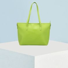 A classic tote.  Cruelty-free leather.  Goldtone top zipper.  Fully lined interior with pcokets.  Side keyring loops.  16.7" x 10.7" x 4.8" (inches). Coin Purses, Purse Pouch, Lime Green, Vegan Leather, Coin Purse, Coin, Mac, Angeles, Pouch