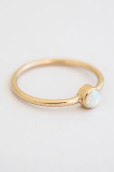 Add some sparkle to your ring stack with this minimal ring. Our Tiny Opal Ring is the perfect ring for opal lovers & October babies! It's made of gold filled, so you'll never have to take it off. Find statement rings, stacking rings, midi rings and more at Simple & Dainty! Rings Stacking, October Baby, Dainty Rings, Minimal Ring, Teardrop Ring, Ring Stack, Midi Rings, Domed Ring, Opal Ring