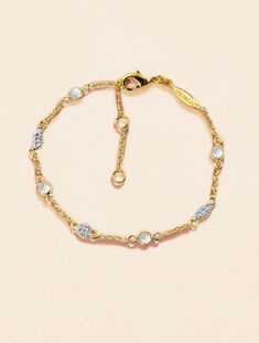 The Sitara bracelet in fine and timeless White Zircons is characterized by a delicate contrast between gold and silver. Once adopted, it will never leave you.

 The Sitara collection represents a bold alliance of gold and silver, in complete freedom! Never Leave You, Gold And Silver, Delicate Bracelet, 18k Gold, Dress Up, Plating, Brass, Bracelet, Stone