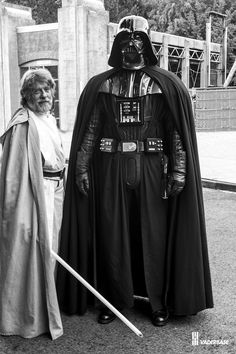 two people dressed in costumes standing next to each other