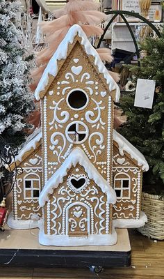 a gingerbread house is on display in a store