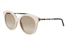 The glasses ship insured Priority Mail and may require a signature for delivery. These guaranteed authentic, NWT GUCCI Ivory Round Cat Eye Sunglasses, style #GG0653S, color code 004, have a 55mm lens width, 18mm bridge width, and a 145mm temple length. The sunglasses have an ivory round cat eye front frame with Dark Gold metal and tan bamboo arms accented with tortoise ear pieces. The lenses are light brown gradient, UV protection with a Category 1 Filter.   The sunglasses have the iconic interl White Cat Eye Sunglasses For Formal Occasions, Formal White Cat Eye Sunglasses, White Round Frame Sunglasses With Gradient Lenses, Classic White Round Frame Sunglasses, Luxury Cream Sunglasses With Gradient Lenses, Elegant Cream Sunglasses With Tinted Lenses, Elegant White Sunglasses For Formal Occasions, Gucci Beige Tinted Sunglasses, Gucci White Sunglasses With Uv Protection