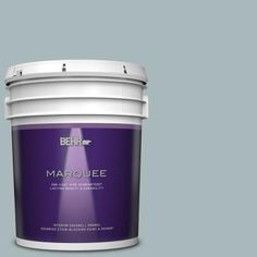 a bucket of behr marquee paint on a beige background with the lid open