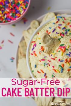 a white bowl filled with sprinkles next to crackers and a pink sign that says skinnyy dunkaroo dip