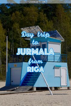 a blue lifeguard tower with the words day trip to journal from riga on it