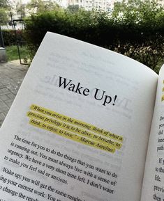 an open book with the words wake up written on it