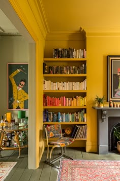 a living room filled with furniture and bookshelves next to a fire place in front of a fireplace