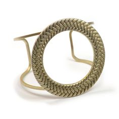 "This bracelet is a modern interpretation of a mid-century 1960s favorite. So true to the era and so relevant to current fashion, it has presence and clean simplicity. A bronze braided circle spans this open cuff, its graceful lines conforming to your wrist. Open cuff is sturdy and is adjustable to your wrist size. Fits sizes 6\" to 8\" wrists. Circle is 2-5/8\" diameter. Signed Sweet Romance Jewelry. Cast and fabricated by hand in our Los Angeles, USA studio." Modern Brass Cuff Bangle, Adjustable Modern Bangle, Modern Adjustable Round Bangle, Modernist Adjustable Round Bracelets, Adjustable Round Modernist Bracelets, Adjustable Modernist Bangle Bracelet, Retro Adjustable Brass Jewelry, Adjustable Retro Brass Jewelry, Modernist Metal Cuff Bangle