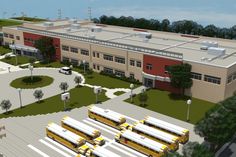 an artist's rendering of a school building with buses parked in the parking lot