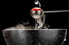 an apple is being cooked in a frying pan with steam rising from the top