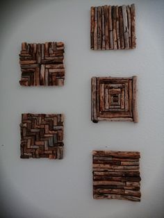 four pieces of wood are arranged on the wall