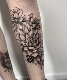 a woman's leg with flowers on it