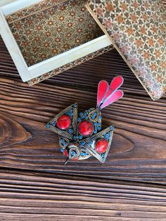 A beautiful and big bird pendant in an eastern style decorated with bright red coral . This gorgeous voluminous necklace is a stylised bird with wings - decorated all around it's tender shape with metal dots and filigree and small turquoises. The loop of the pendant is just under the bird's tail, laying it comfortably on the chest. It will be a perfect addition to a breezy boho outfit, but can also be a casual jewelry piece, combined with strict work clothes. Freaky Cave: If you would like to ch Boho Outfit, Lapis Lazuli Pendant, Carnelian Ring, Special Necklace, Ethnic Necklaces, Casual Jewelry, Red Bird, Bird Pendant, Big Bird