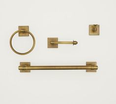 an image of brass bathroom accessories on white background