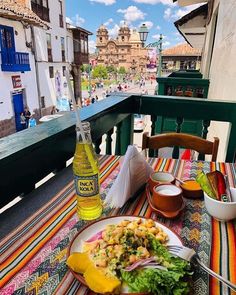 a plate of food sitting on top of a table next to a bottle of beer