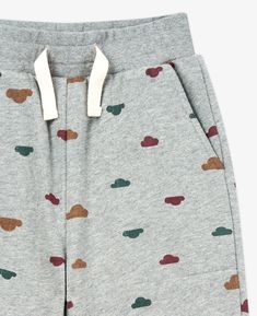 These relaxed active joggers are an essential item for every closet. Made from cotton in our Morning Clouds print, it has the perfect pop of colour, but is still the perfect neutral that will virtually match with anything. These active joggers have a tie front so they could adjust and fit your little one perfectly. Made from 100% cotton, these joggers will make your child feel like they’re being hugged by fluffy clouds. The trim has a touch of spandex which will allow your child to move comforta Spring Cotton Joggers With Ribbed Waistband, Spring Cotton Joggers For Athleisure, Trendy Cotton Joggers For Jogging, Spring Cotton Joggers With Elastic Waistband, Spring Cotton Joggers With Comfort Waistband, Sporty Cotton Sweatpants For Playwear, Playful Cotton Sweatpants For Loungewear, Playful Cotton Joggers For Loungewear, Spring Cotton Joggers With Elastic Cuffs