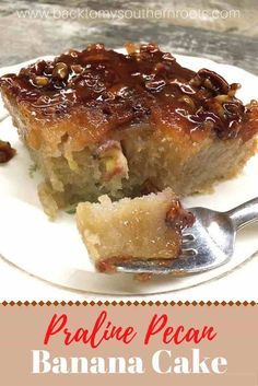 a piece of banana pecan cake on a white plate with a fork and spoon