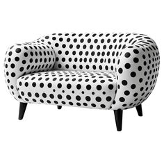 a black and white chair with polka dots on it