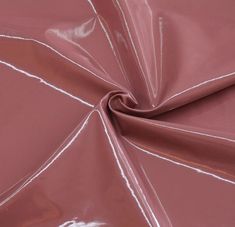 a close up view of a pink fabric with white lines on the top and bottom