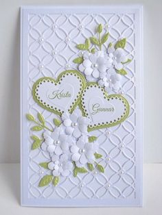 a card with two hearts and flowers on it