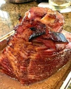 a large piece of meat sitting on top of a cutting board