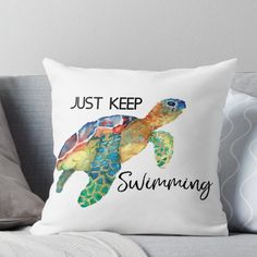 a pillow that says, just keep swimming with a sea turtle on it's back