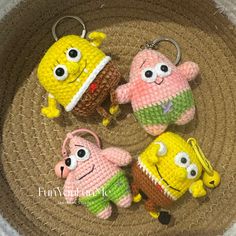 four crocheted keychains in the shape of cartoon characters