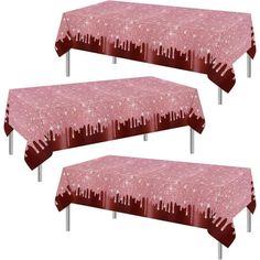 three pink tablecloths with cityscape on them and two silver metal legs