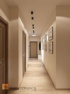 an empty hallway with pictures on the wall