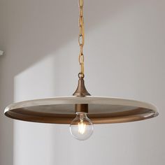 a light fixture hanging from a ceiling in a room