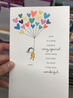 someone holding up a card with hearts on it that says once in a while, someone very special comes along and makes the world a little more wonderful