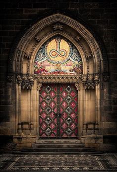 an ornate doorway with a stained glass window