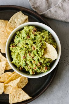 guacamole and tortilla chips on a plate