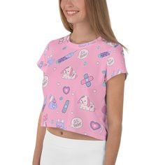 "A kawaii pink and purple menhera shirt featuring Nurse Ducky making it all better for her sickly cute bunny and teddy bear, and duck patients. This boxy cropped t-shirt, which has a slightly silky, knit feel, also has contrasting bandages, pills, and syringes. It's unisex and would be a comfy casual addition to your menhera wardrobe without being aggressive. Double check sizing before ordering. Would be a great present for those in the medical field. Apparel and bedding ship separate from handm Pink Short Sleeve Top With Hello Kitty Print, Pink Crew Neck T-shirt With Cute Design, Kawaii Cute Crew Neck Tops, Kawaii Crew Neck Top With Cute Design, Cute Kawaii Crew Neck Top, Cute Pink T-shirt With Funny Print, Fitted Kawaii Tops With Hello Kitty Print, Fitted Hello Kitty Print Kawaii Tops, Fitted Pink Tops With Cartoon Print