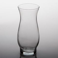 a clear glass vase sitting on top of a table