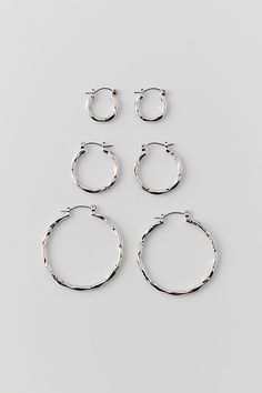 Hammered hoop earrings set with three pairs of earrings that includes small earrings, medium hoop earrings and large hoop earrings. Features Hammered hoop hoop earring set Set of three pairs of earrings Includes small, medium and large hoop earrings Available in polished silver or gold metal Latch closures Content + Care Includes 3 pairs Mixed metals Wipe clean Imported | Hammered Hoop Earring Set in Silver, Women's at Urban Outfitters Elegant Everyday Jewelry By Urban Outfitters, Elegant Everyday Jewelry From Urban Outfitters, Urban Outfitters Hoop Jewelry, Hoop Earring Set, Hammered Hoop Earrings, Hoop Earring Sets, Small Earrings, Mixed Metals, Earrings Set