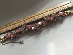 "Delizza and Elster, Juliana design with pink rhinestones and givre lavender satin glass teardrop accents. Beautiful, sparkling diamond like gems on this lovely link bracelet with a gold finish. A larger pink chaton is on a link that links two other ornate gem clusters. A total of five clusters and six large gem connectors. There is a chain guard as well as the very secure clasp. Wear this lovely bracelet on your fanciest outing. Quite a stunning and rare Juliana by Deliza and Elster from their Pink Crystal Bracelet For Formal Occasions, Pink Crystal Bracelet With Sparkling Stones For Party, Pink Crystal Bracelets For Formal Occasions, Elegant Pink Jeweled Bracelets, Formal Pink Crystal Bracelet, Pink Evening Jewelry With Bling, Pink Bling Jewelry For Evening, Elegant Pink Bling Bracelets, Evening Pink Bling Jewelry